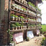 Self watering vertical garden with recycled water bottles